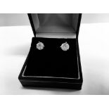 2.00ct Solitaire diamond stud earrings set with brilliant cut diamonds which have been enhanced. I