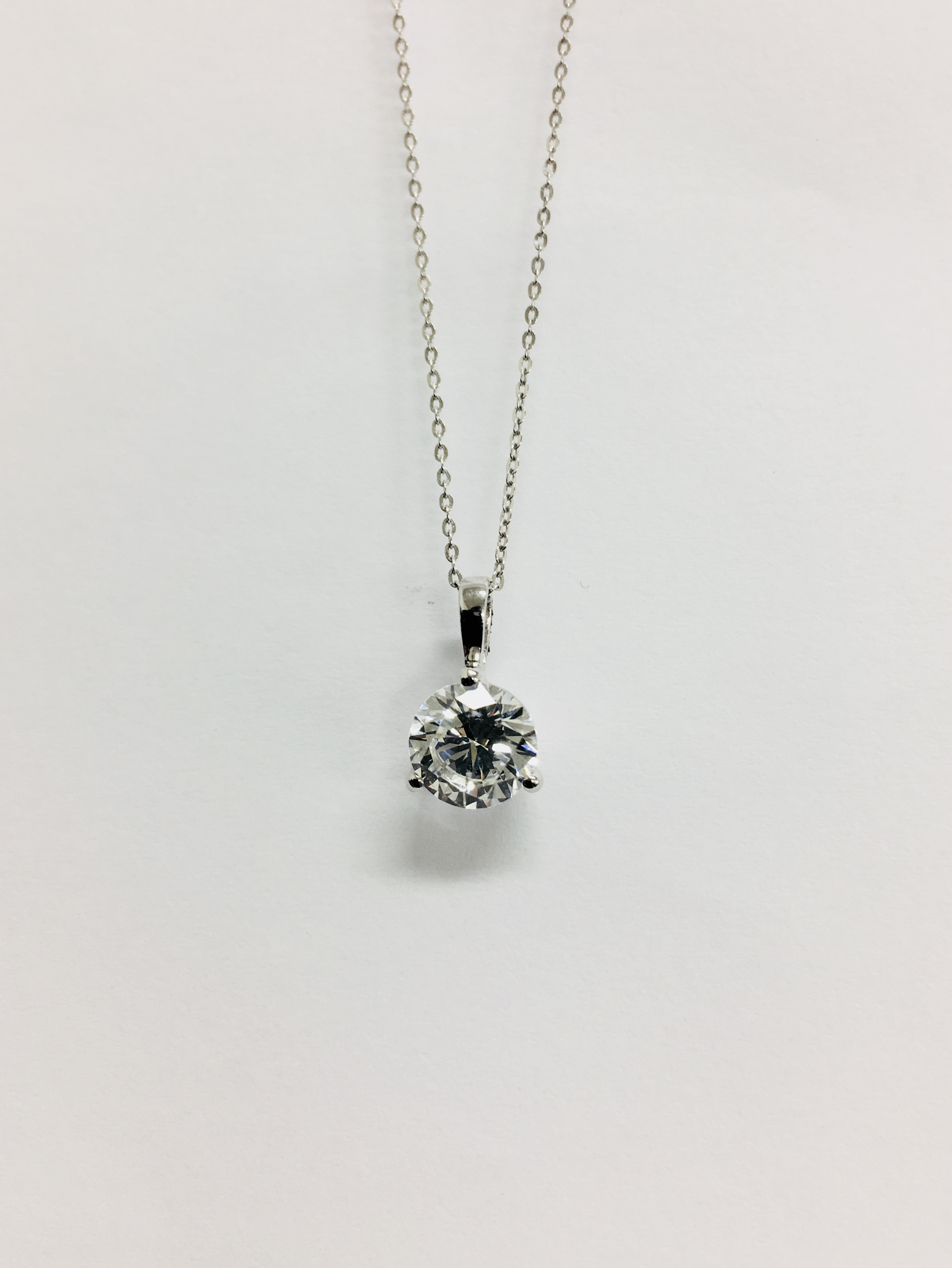 1.01ct diamond solitaire pendant. I colour, si3 clarity. Set in a platinum 4 claw mount with a split