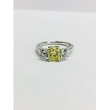 Platinum three stone Diamond ring,1ct natural yellow diamond centre,i1 clarity,two 0.50ct round