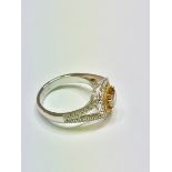 1.15ct diamond set solitaire ring with a yellow cushion cut yellow diamond and a halo setting and