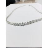 11.75ct Diamond tennis style necklace. 3 claw setting. Graduated diamonds, I colour, Si2 clarity