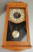 Seiko Wood Cased Wall Clock. Measures 20 inches by 5 inches by 9 inches. Part of a recent Estate