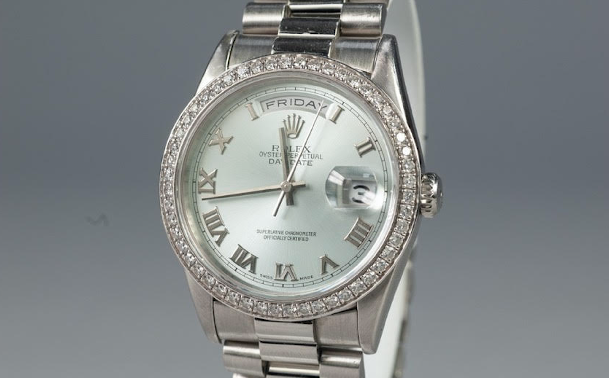 Men’s Platinum Rolex DayDate with Factory Set Roman Numeral Dial and Factory Set Diamond Bezel 36MM