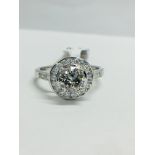 Platinum Channel set Halo style diamond ring,1.40ct diamond weight,centre 0.90ct,H colour