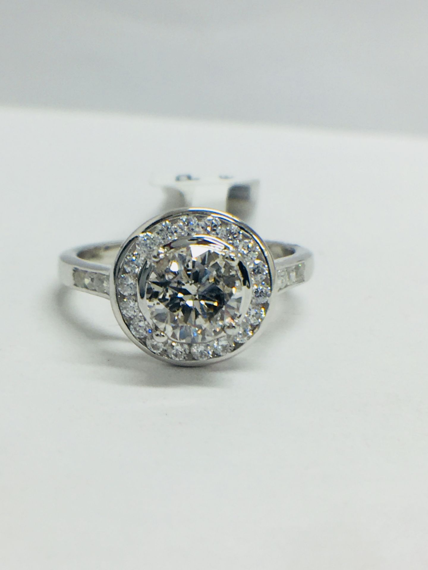 Platinum Channel set Halo style diamond ring,1.40ct diamond weight,centre 0.90ct,H colour