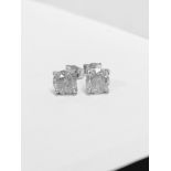 2.00ct Solitaire diamond stud earrings set with brilliant cut diamonds which have been enhanced. H/I