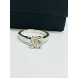 1.02 ct diamond twist solitaire ring set in platinum. 6 claw setting. Enhanced brilliant cut