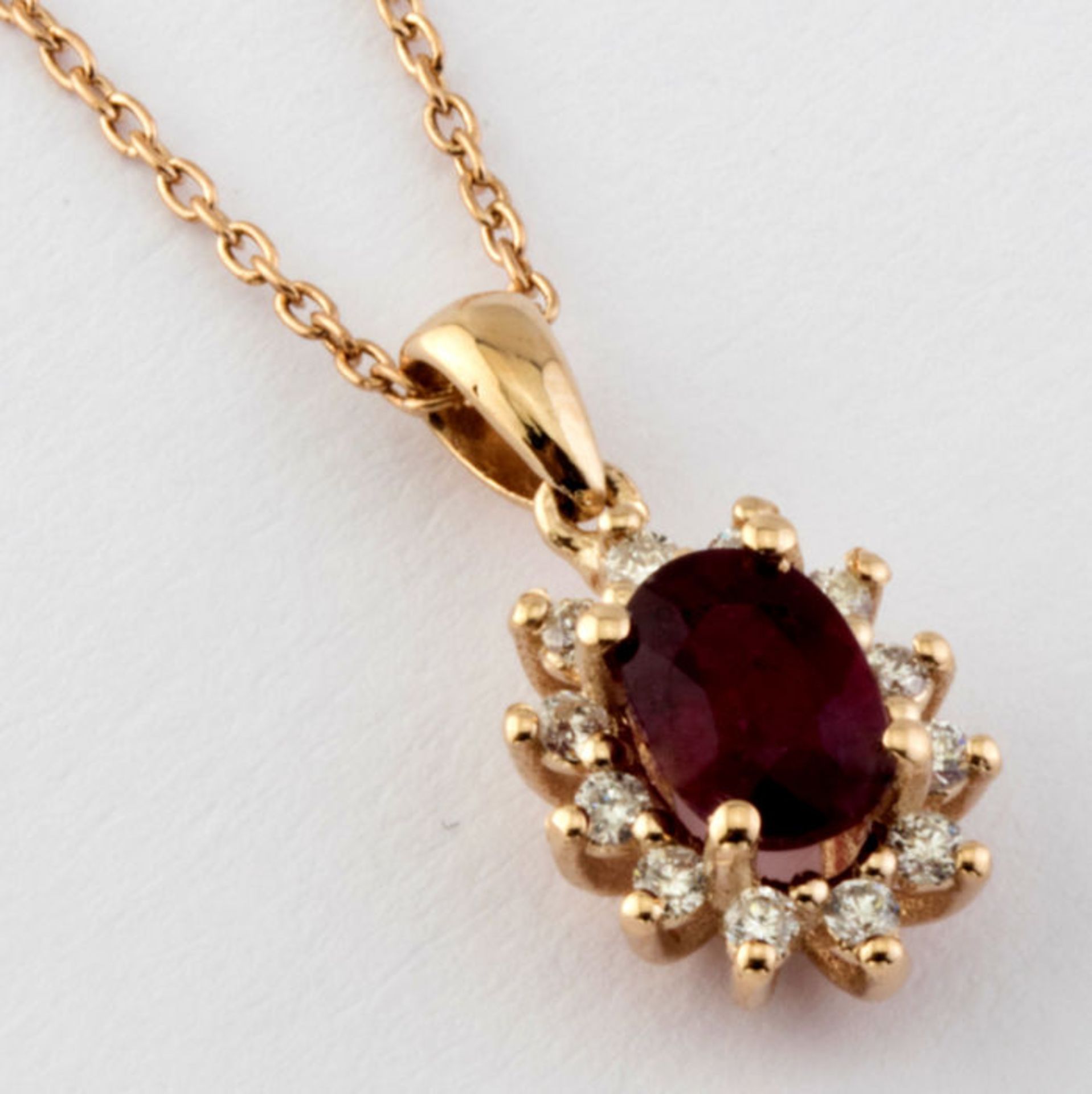 14K Pink Gold Cluster Pendant set with a natural ruby and 12 brilliant cut diamond 0,65ct in total