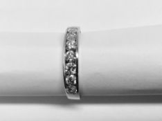 0.70ct diamond band ring set with 7 brilliant cut diamonds in a channel setting. H/I colour and