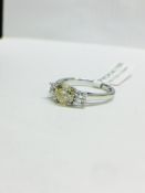 Platinum diamond three stone ring,1ct centre diamond natural fancy yellow colour ,si2 clarity,0.50ct