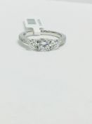 Platinum Diamond Three stone ring with diamond set shoulders,1.10ct diamond weight,one 0.50ct