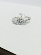 Platinum Diamond Three stone Ring,0.50ct brilliant cut centre,0.50ct in sidestones,h colour si
