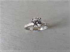 0.70ct diamond solitaire ring set in platinum. I colour,si1 clarity. 4 claw setting with a grooved