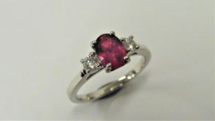 Ruby and diamond trilogy ring. 1ct, 7 x 5mm oval ruby ( fracture filled ) with a brilliant cut