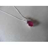 2.40ct ruby and diamond pendant with an 9x7mm oval cut ruby ( fracture treated ) and a diamond set