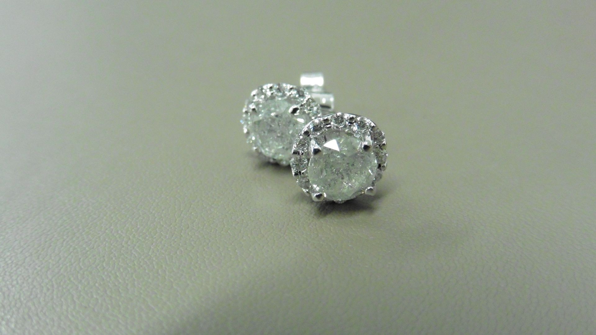 2.00ct Diamond set solitaire style earrings. Each set with 1ct brilliant cut diamond ( enhanced