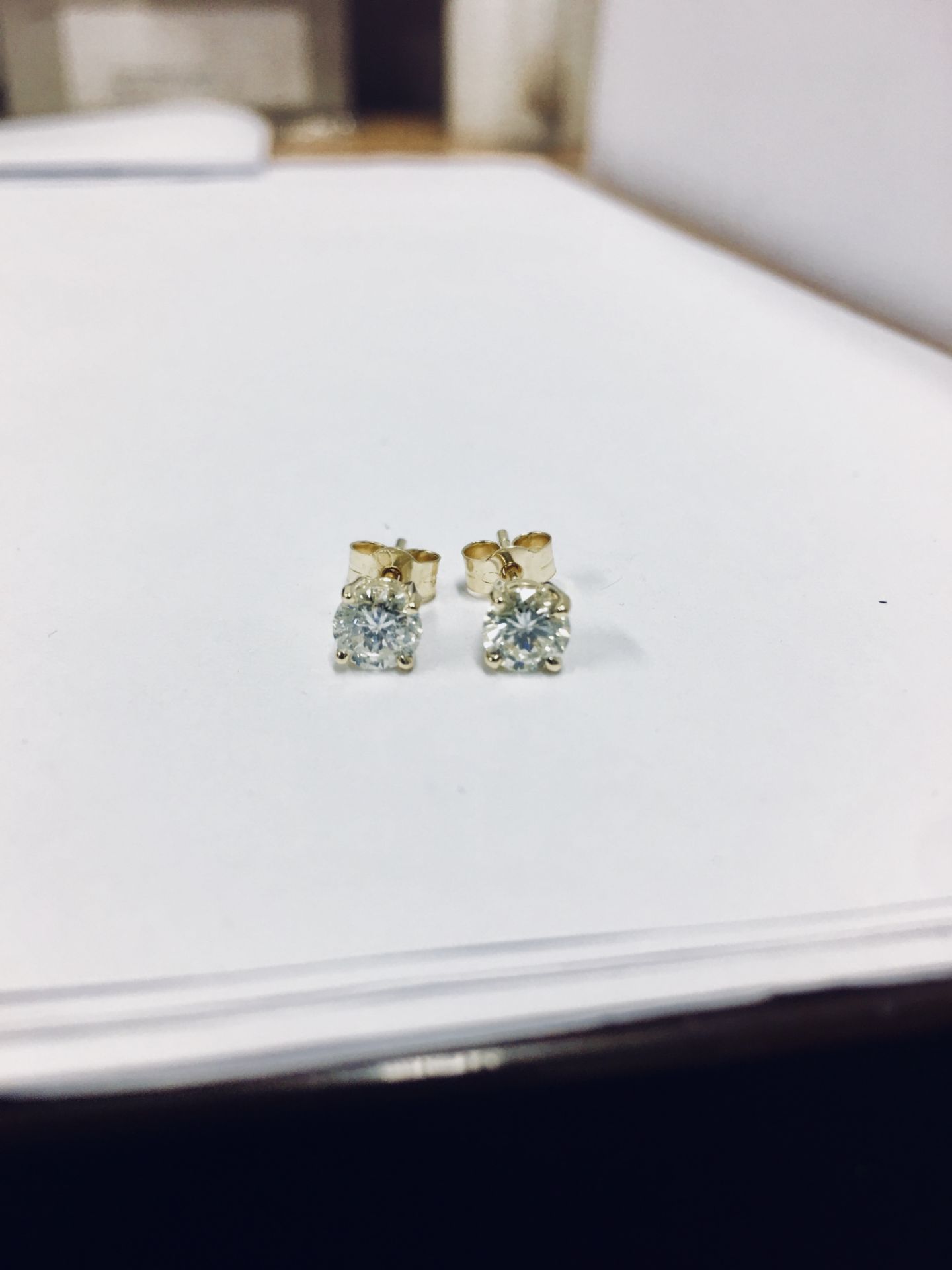 1.40ct Diamond solitaire earrings set with brilliant cut diamonds, I colour i2 clarity. Four claw