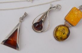 Three Amber And Silver Pendants And One Chain
