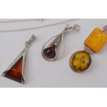 Three Amber And Silver Pendants And One Chain