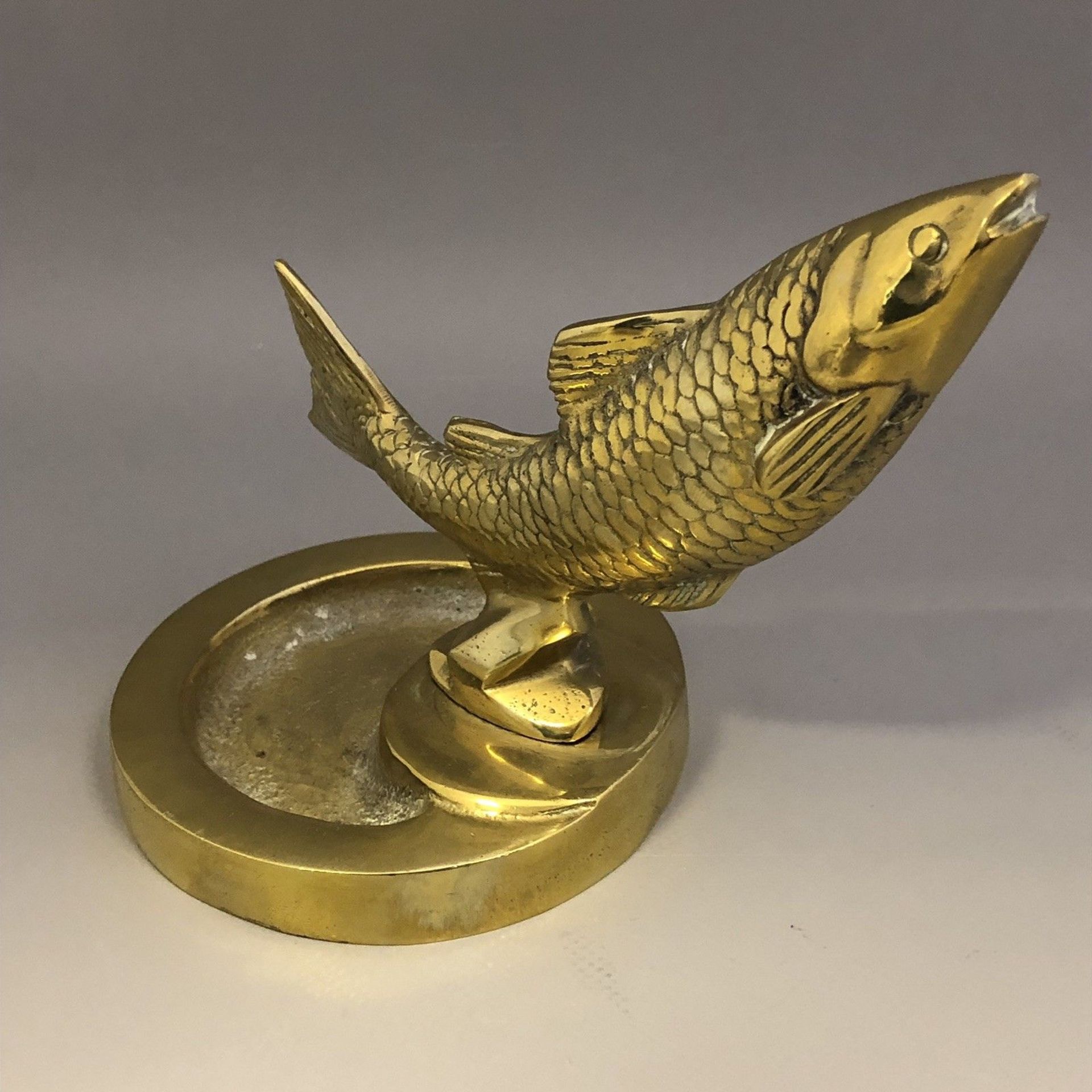 Vintage cast brass ashtray with leaping salmon mount fishing interest car mascot