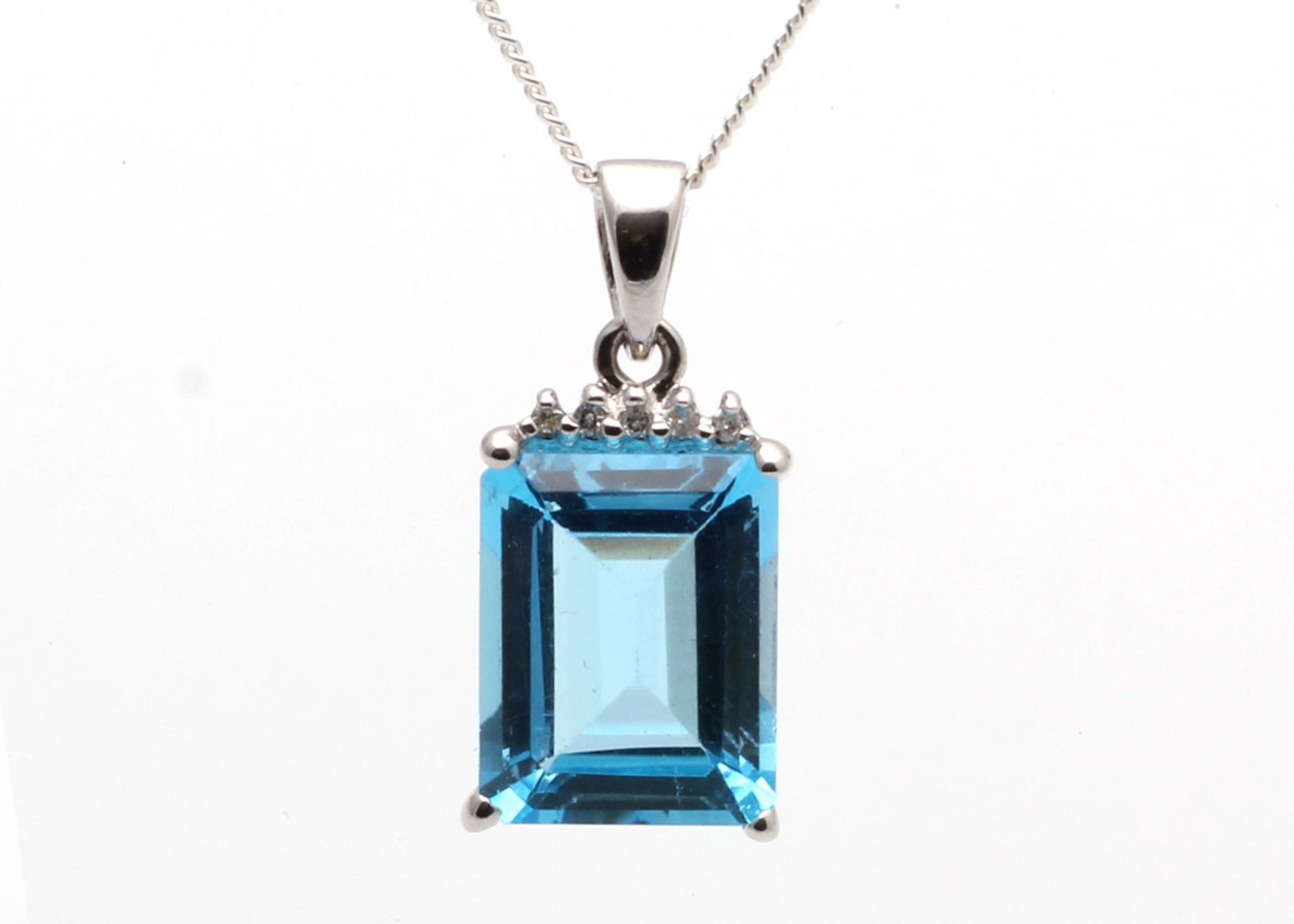 9k White Gold Diamond And Blue Topaz Pendant 0.01