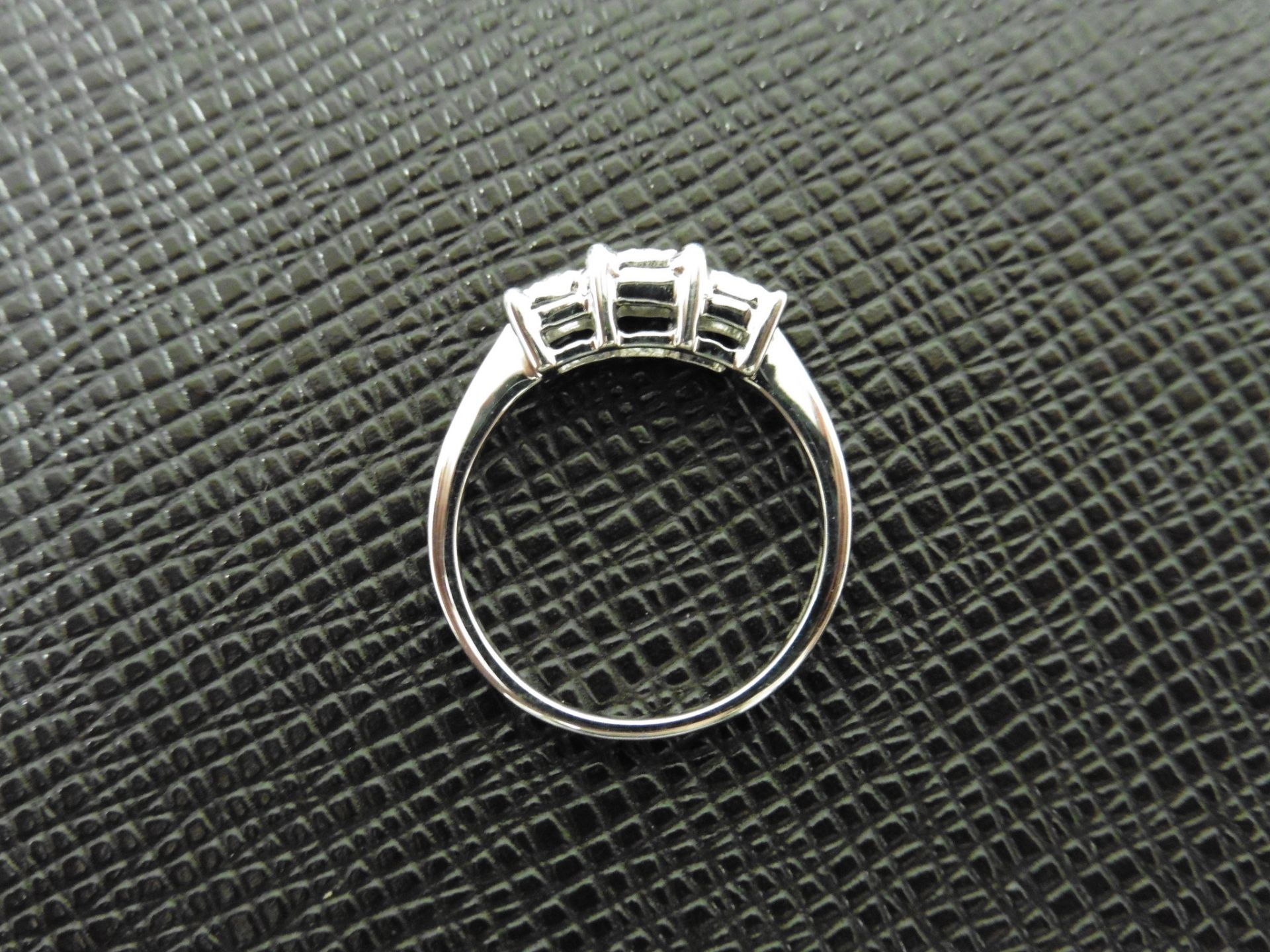 0.15ct trilogy style diamond ring set in 9ct white gold. Illusion setting with 3 small round cut - Image 2 of 2