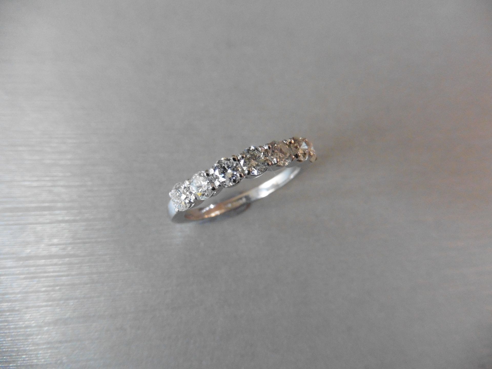 1.10ct white gold diamond ring set with 7 brilliant cut diamonds, I colour, si3 clarity. Simple 4