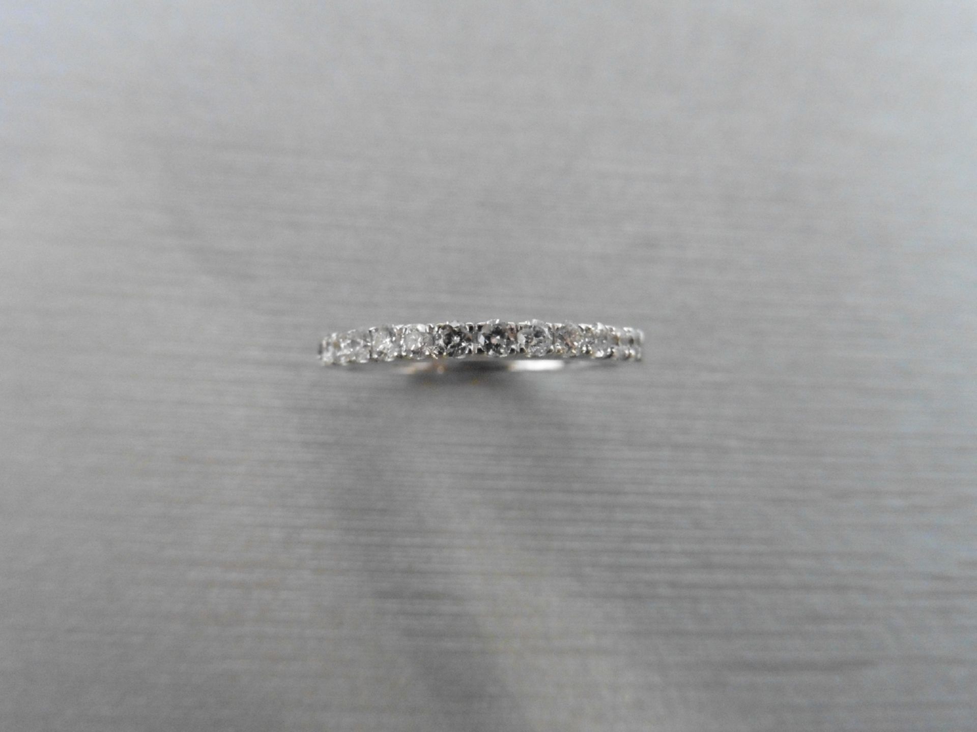 0.35ct diamond eternity style band ring set in 9ct. 13 brilliant cut diamonds, I colour si3 clarity.