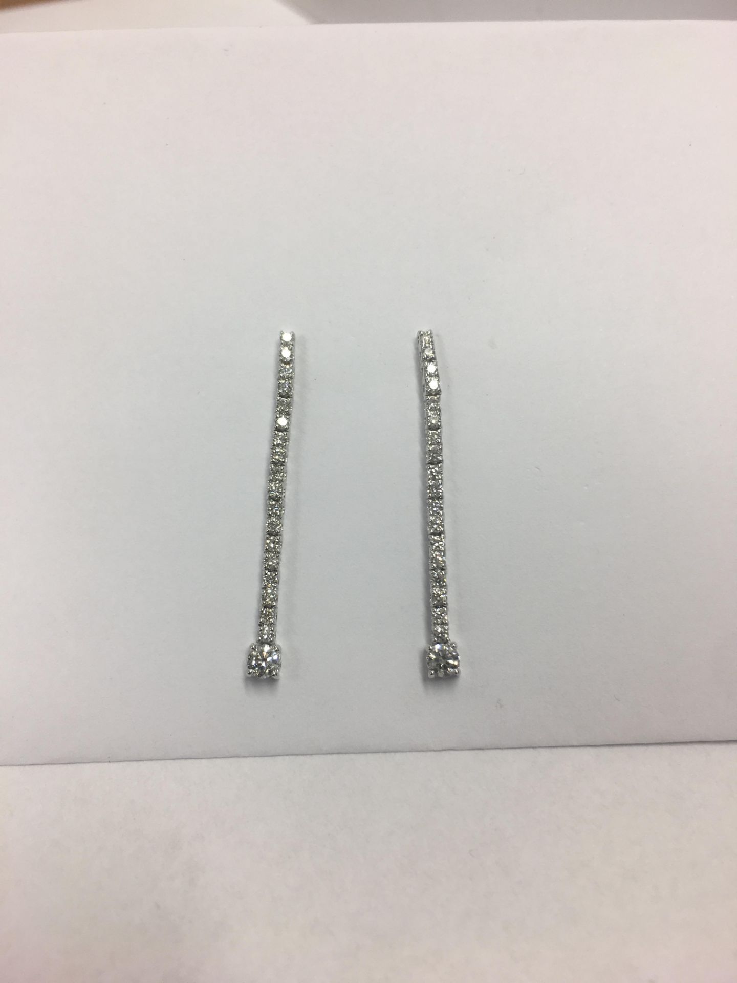 0.60ct diamond drop earrings set in 18ct white gold. Claw setting. Brilliant cut diamonds, H