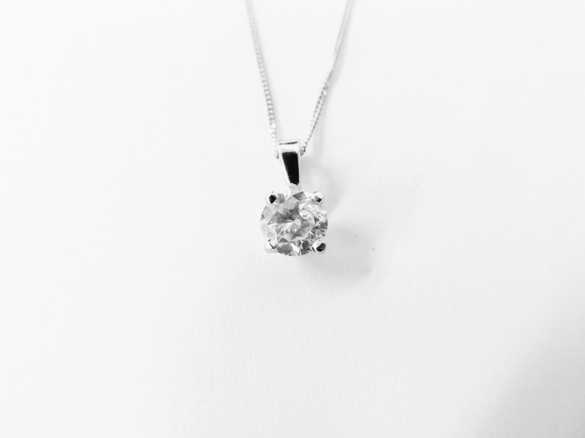 0.50ct diamond solitaire pendant set in 18ct gold. 4 claw setting, plain bale. Enhanced brilliant