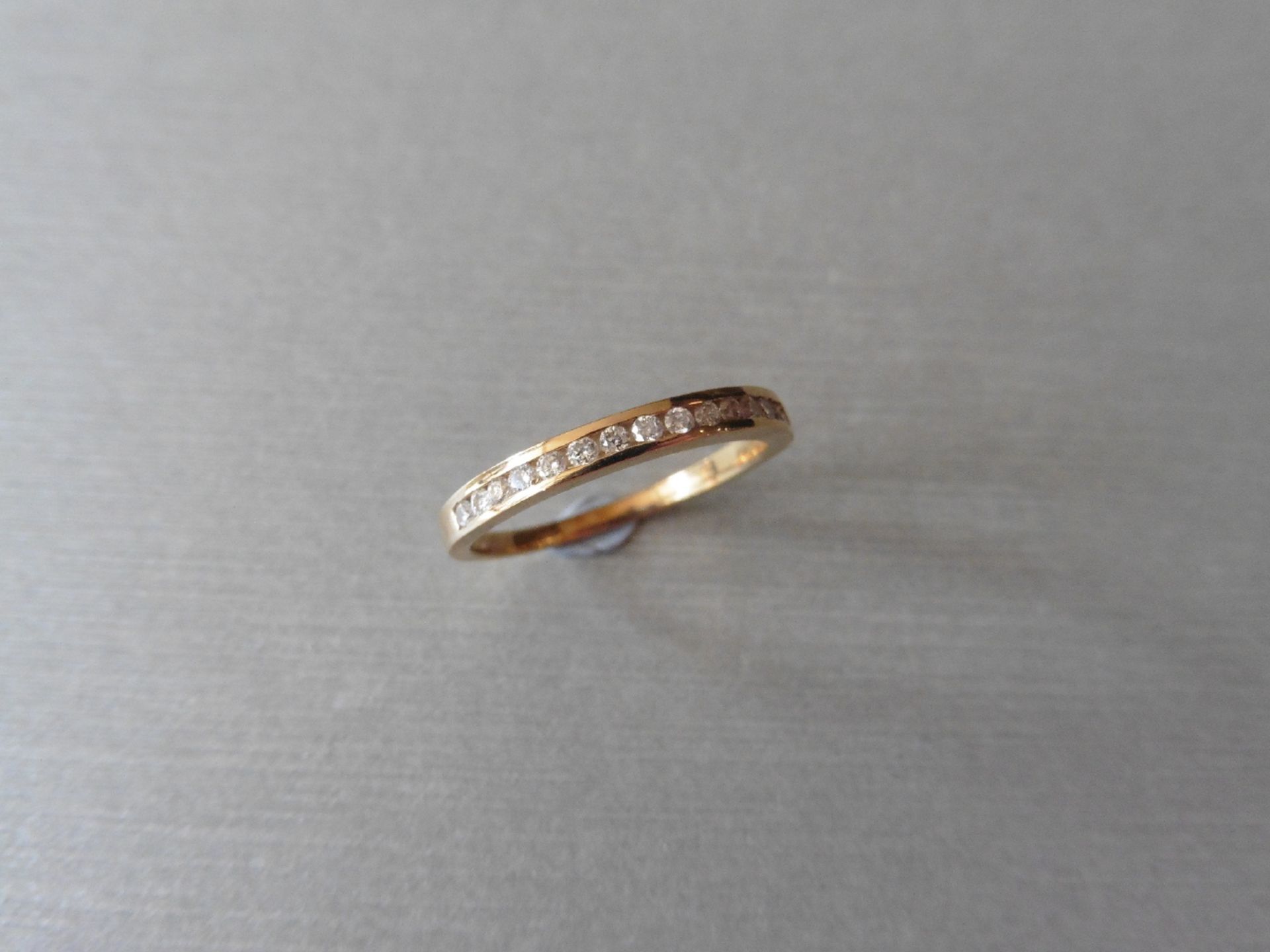 0.15ct diamond eternity ring set in 9ct rose gold. Channel setting, H,I colour, Si2 clarity. Ring