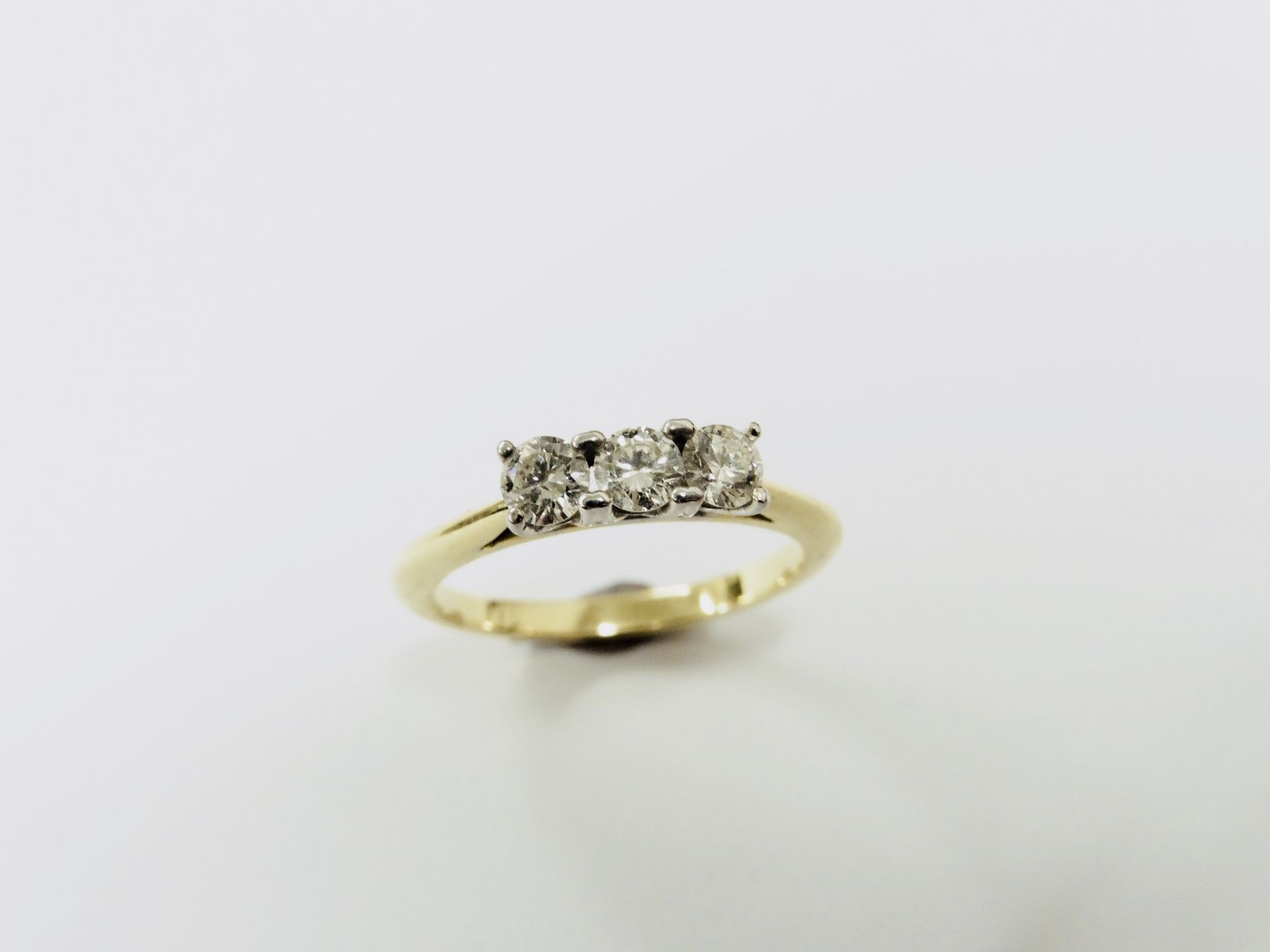 0.60ct diamond trilogy ring set in 18ct gold. Brilliant cut diamonds, I/J colour and Si3 clarity. - Image 2 of 2