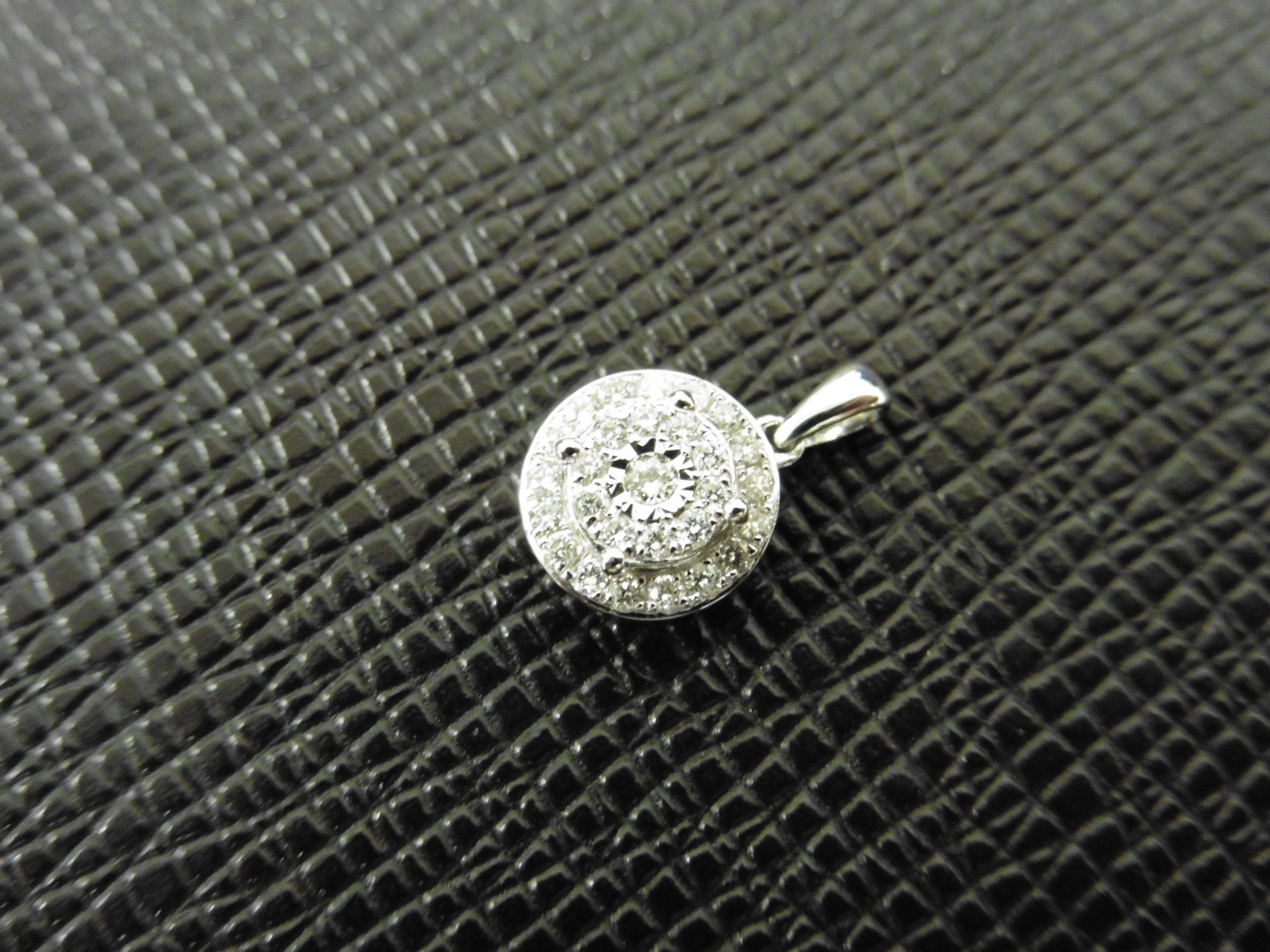 0.24ct illusion set diamond pendant in 9ct white gold. Small round cut diamonds, H colour and I1 - Image 2 of 2