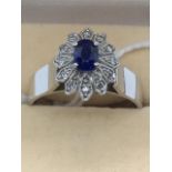 18ct White Gold Ring Set with A Sapphire and Diamonds