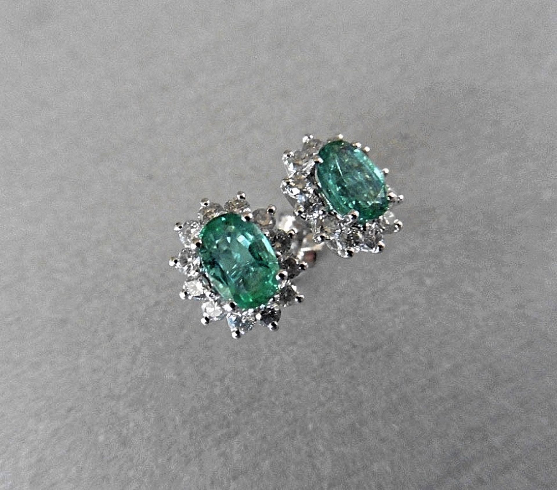 1.60CT EMERALD AND DIAMOND CLUSTER STYLE STUD EARRINGS.