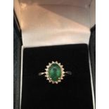 A 9 Carat Gold Emerald and Diamond ring