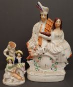 Antique 2 x Staffordshire Flatback Figures Includes Clock Face. They measure 21cm and 36cm tall.