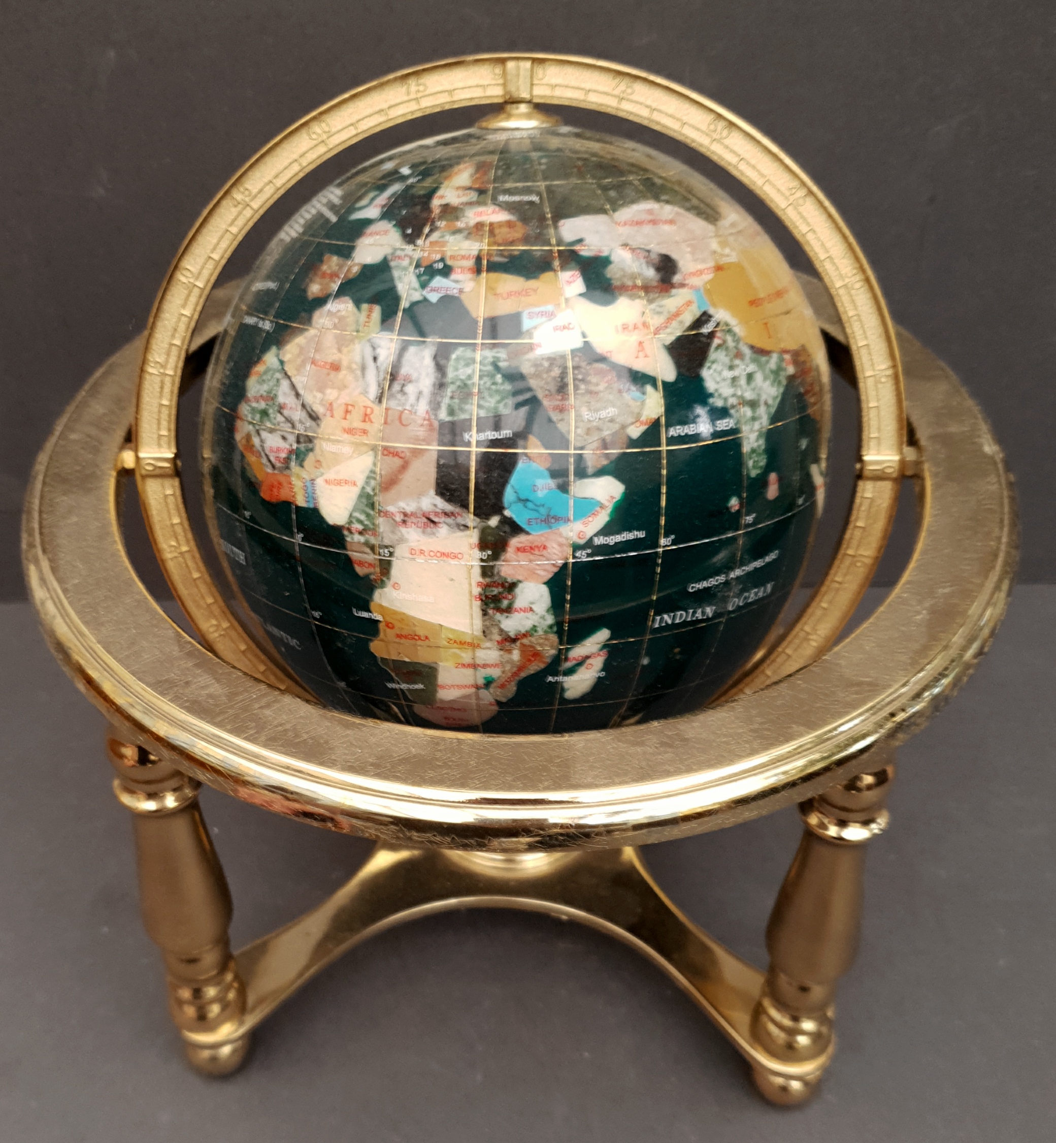 Vintage Brass and Agate Decorative Globe on a Green Ground. Measures 9 inches diameter. Part of a