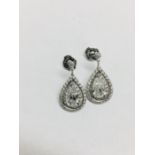 2.04ct diamond drop earrings. Each set with a certificated pear shaped diamond with a halo setting.