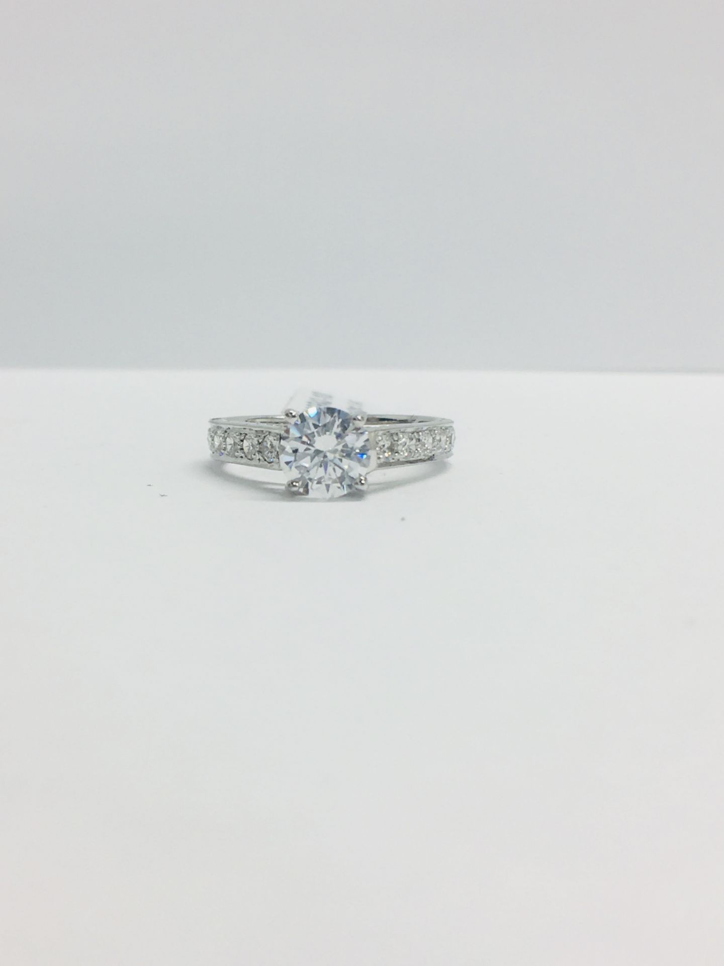 Platinum Diamond Solitaire Ring With Diamond Set Shoulders