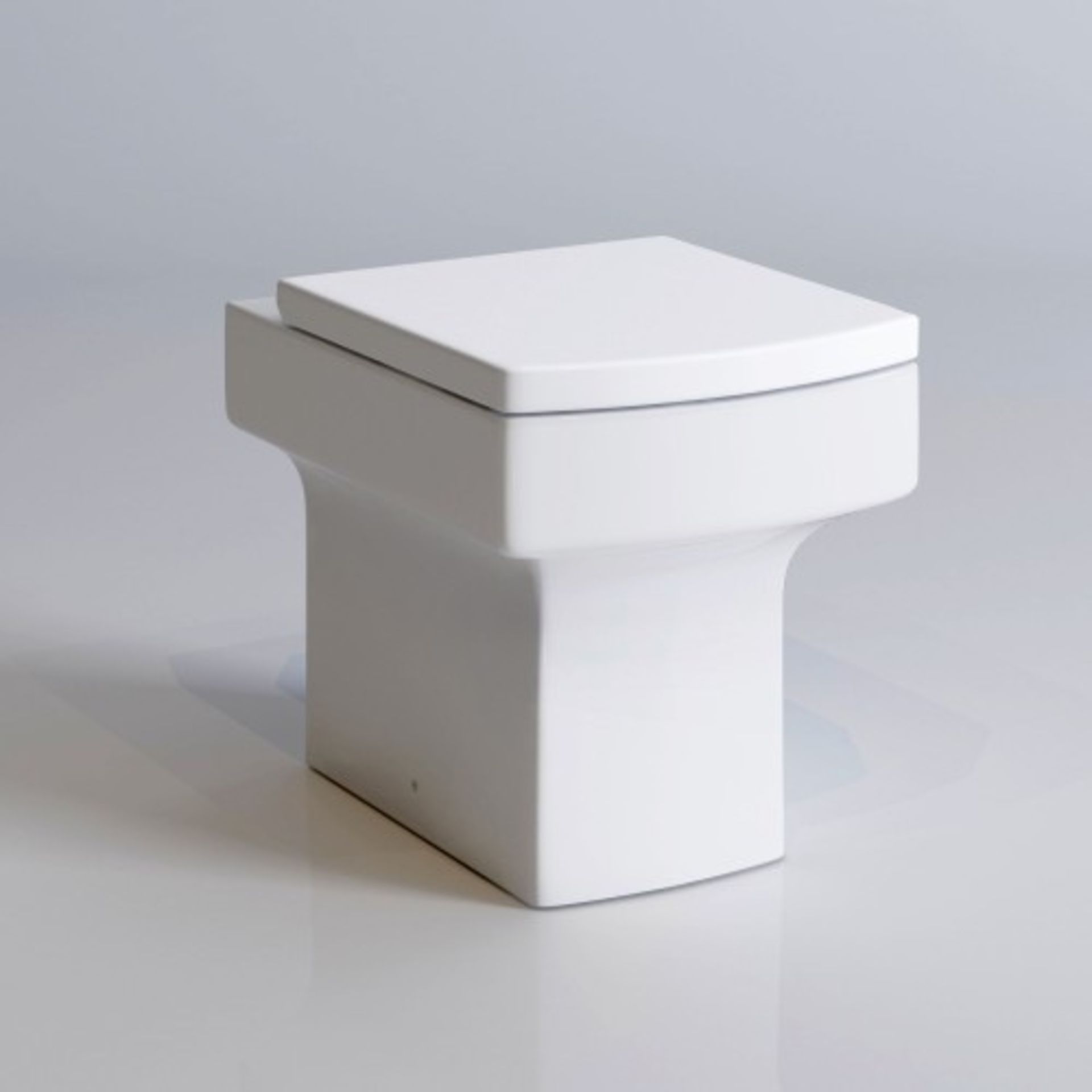 (G65) BELFORT BACK TO WALL TOILET INC SOFT CLOSE SEAT. Made from White Vitreous China Anti-sc...