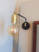 A pair of brushed gold & black wall mounted light fittings with amber led lamp. Commercial quality