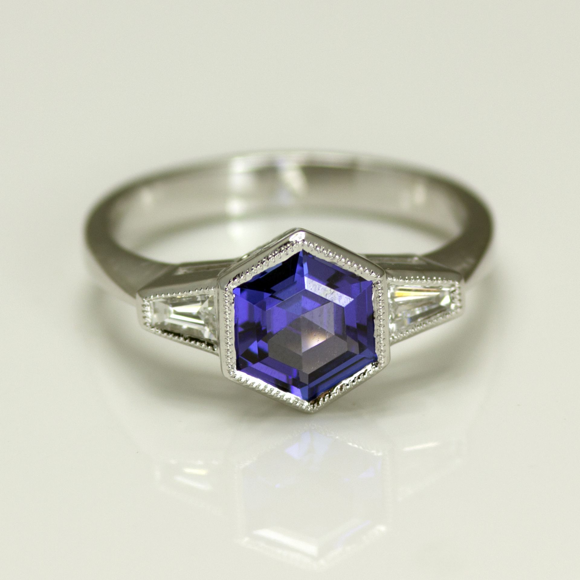 18ct White Gold Hexagon Tanzanite with Tapered Baguette Diamonds either side. Total Diamond 0.20ct