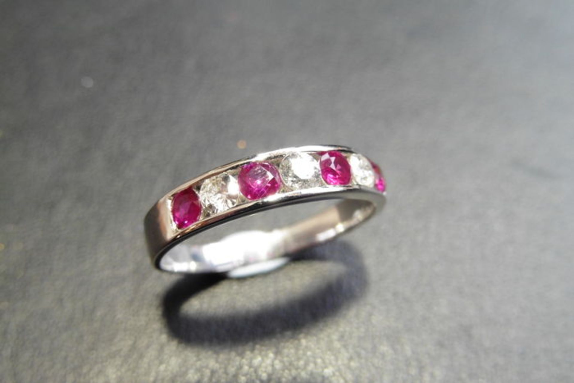 Ruby And Diamond Eternity Band Ring Set In 9Ct White Gold.