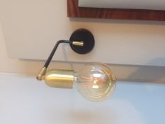 A pair of brushed gold & black wall mounted light fittings with amber led lamp. Commercial quality