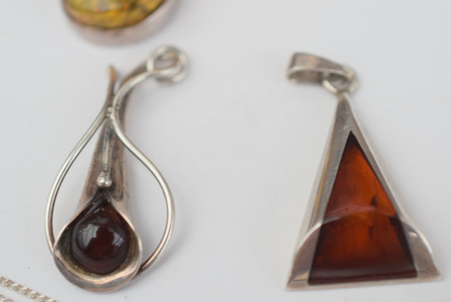 Four Silver And Amber Pendants One On A Silver Chain - Image 4 of 4