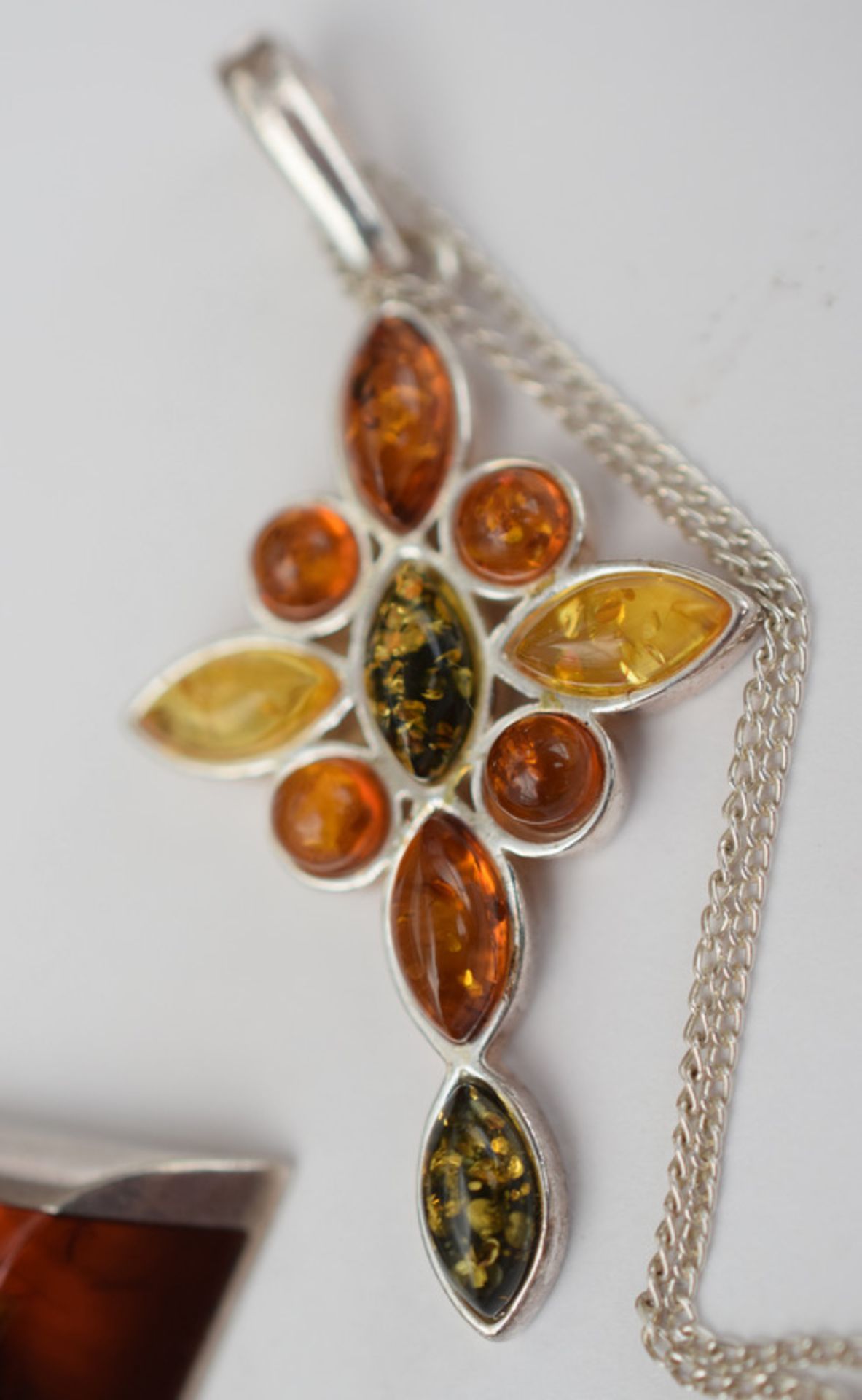 Four Silver And Amber Pendants One On A Silver Chain - Image 3 of 4