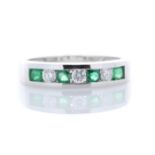 9ct White Gold Channel Set Semi Eternity Diamond And Emerald Ring 0.25
