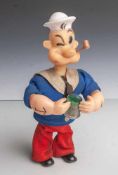 Spielzeugfigur Popeye (Hersteller K.E.S, 1967), mechanisch durch Schlüsselaufzug, er hebtseine
