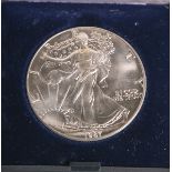 One Dollar "Liberty" (USA, 1987), 999/1000 Silber, Dm. ca. 4 cm, im orig. Etui.Stempelglanz.- - -